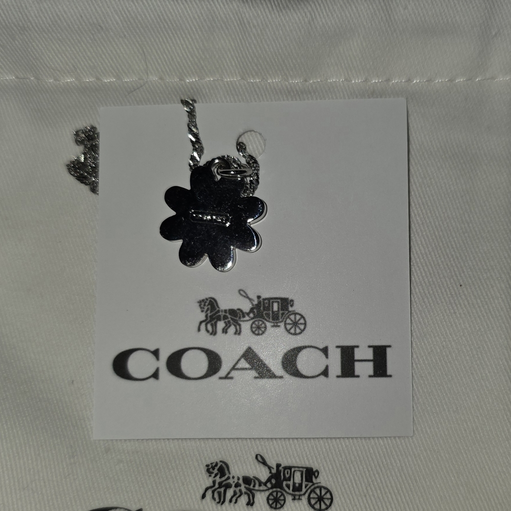 COACH Silver And Orange Daisy Pendant Necklace - Picture 3 of 6